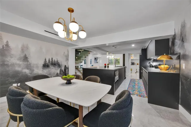 a view of a dining room with furniture and chandelier