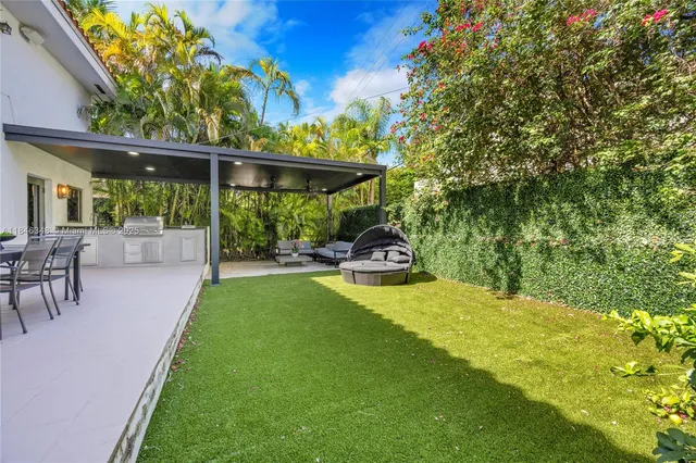a kitchen with a sink and wooden cabinets
