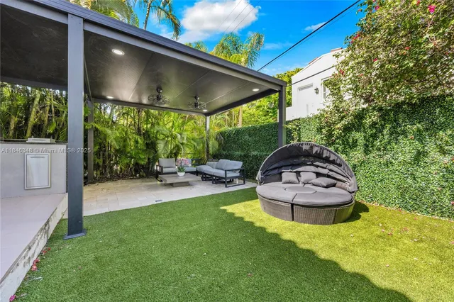 a view of a chair and table in the garden