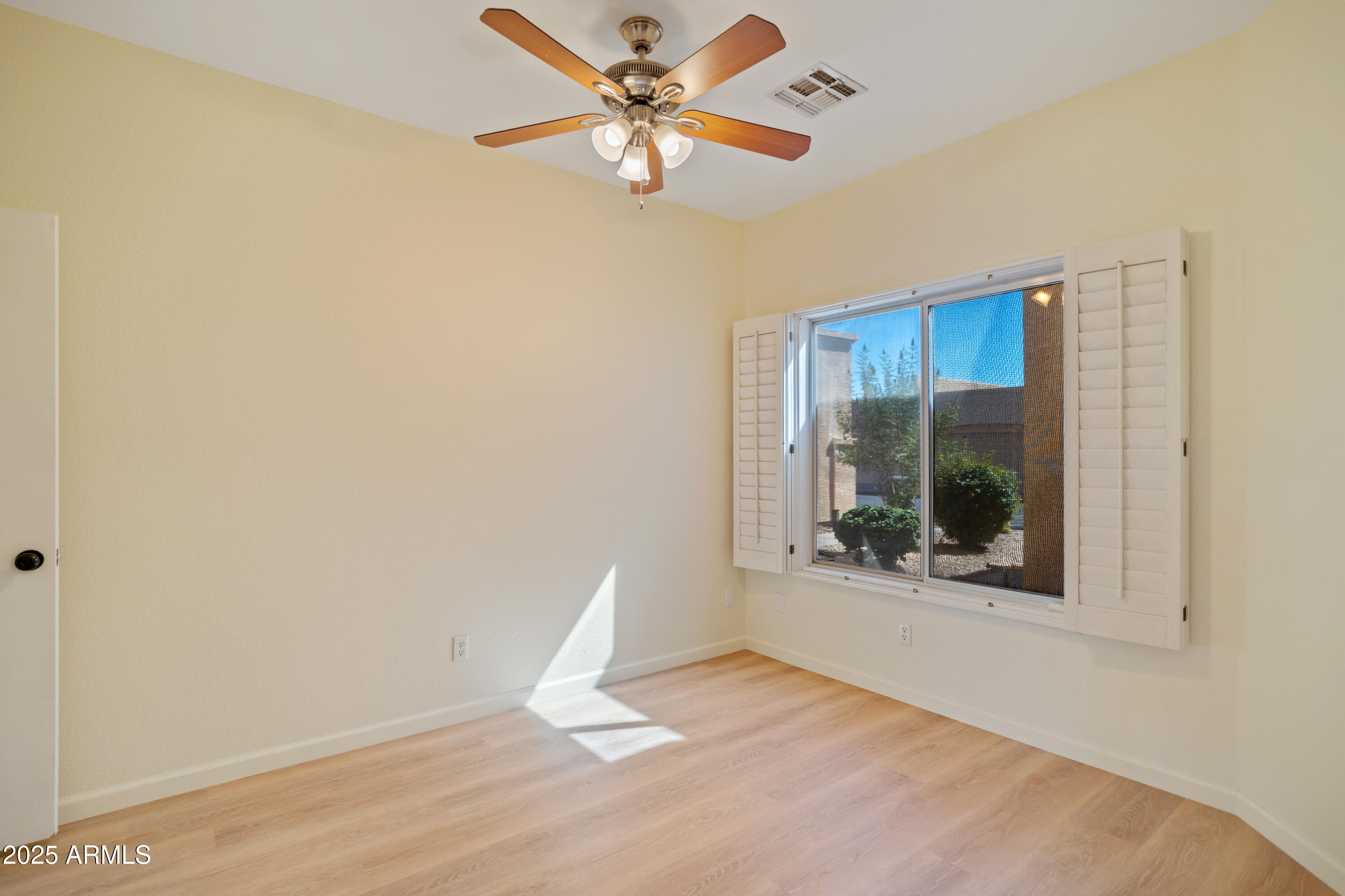 625 North Hamilton Street, Unit 41 Chandler, AZ 85225 - Photo 14 of 25 a view of a livingroom with a window and wooden floor