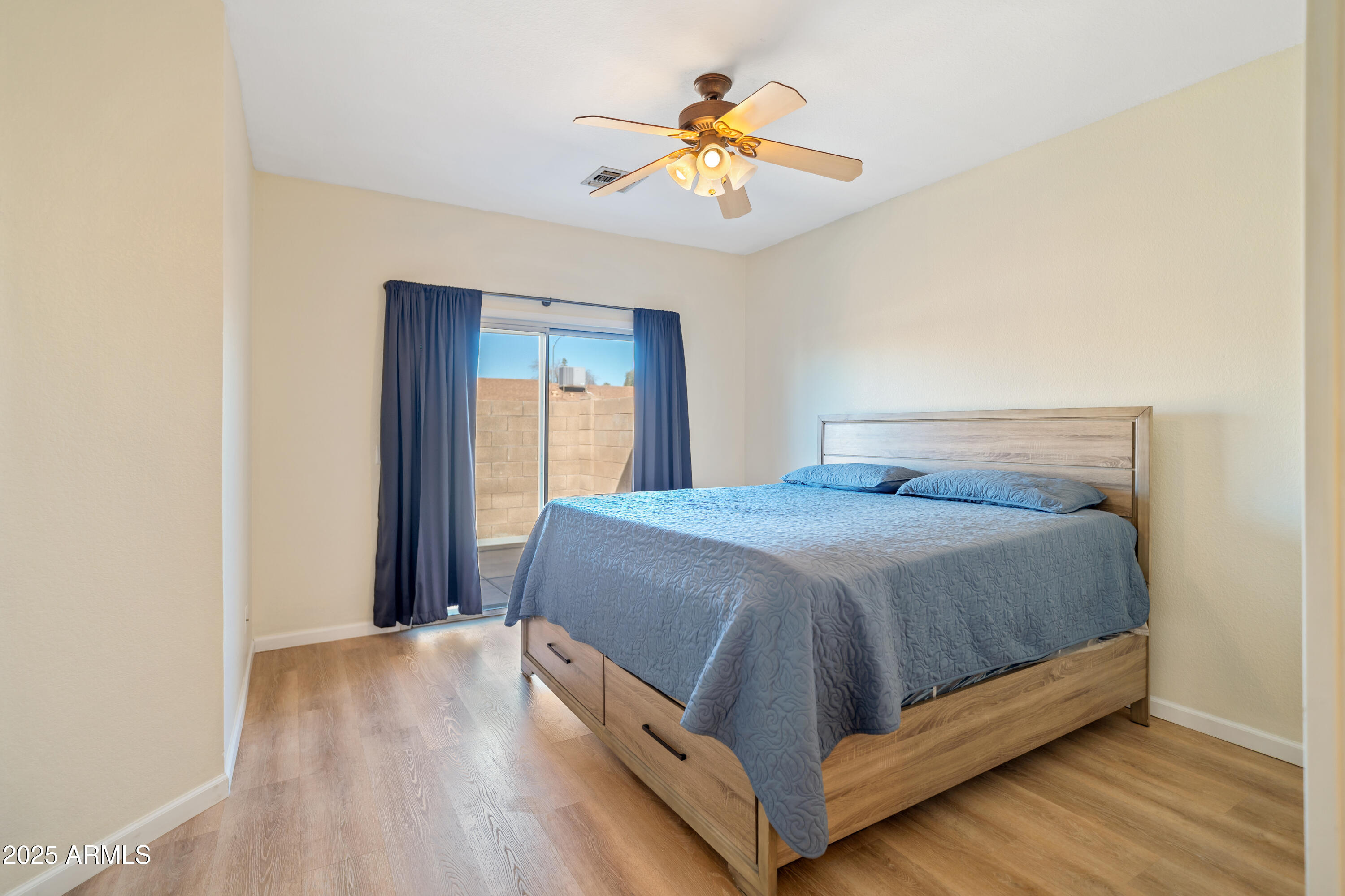 625 North Hamilton Street, Unit 41 Chandler, AZ 85225 - Photo 17 of 25 a bed sitting in a bedroom next to a window