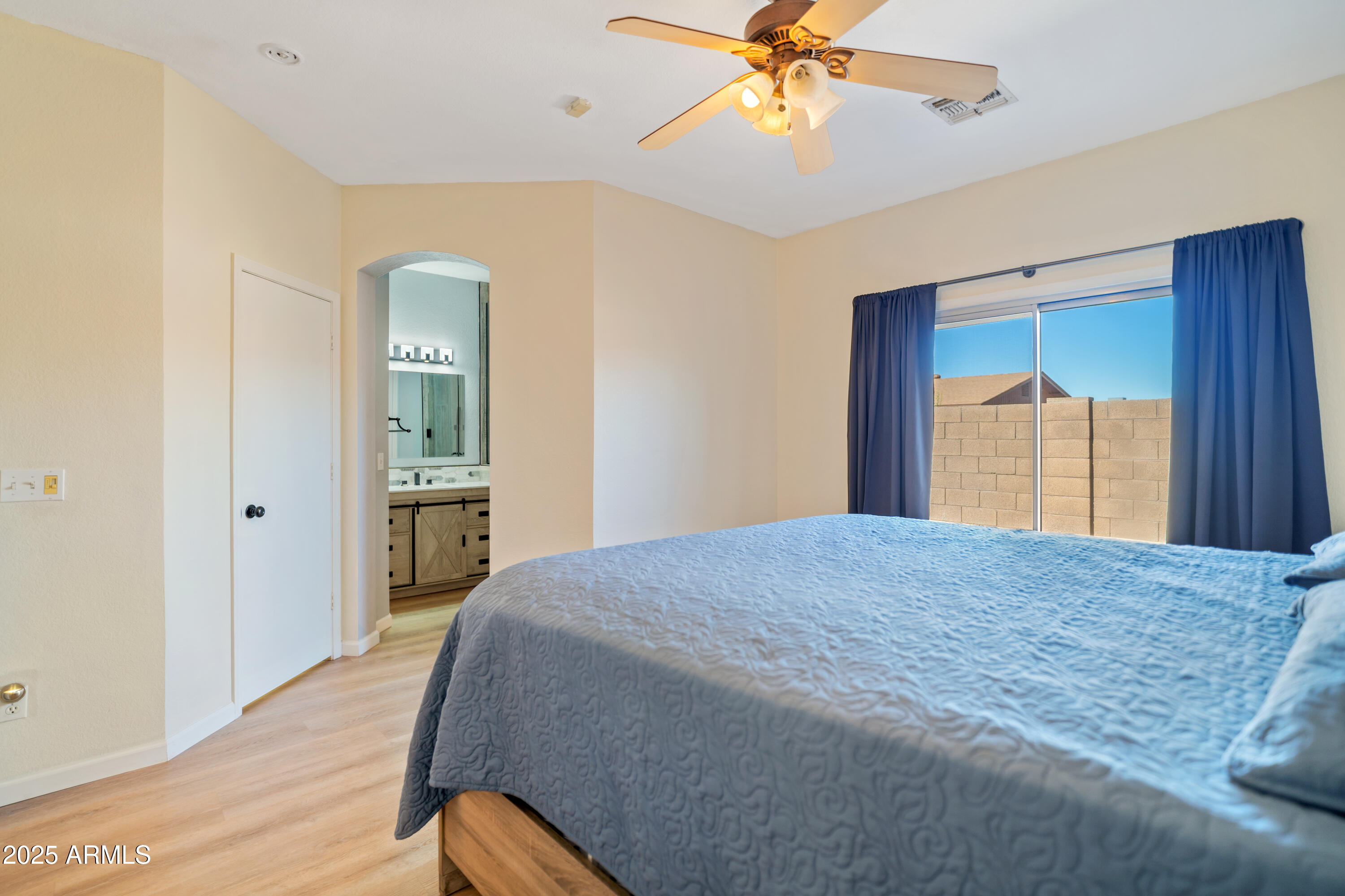 625 North Hamilton Street, Unit 41 Chandler, AZ 85225 - Photo 18 of 25 a bedroom with a bed and a chandelier