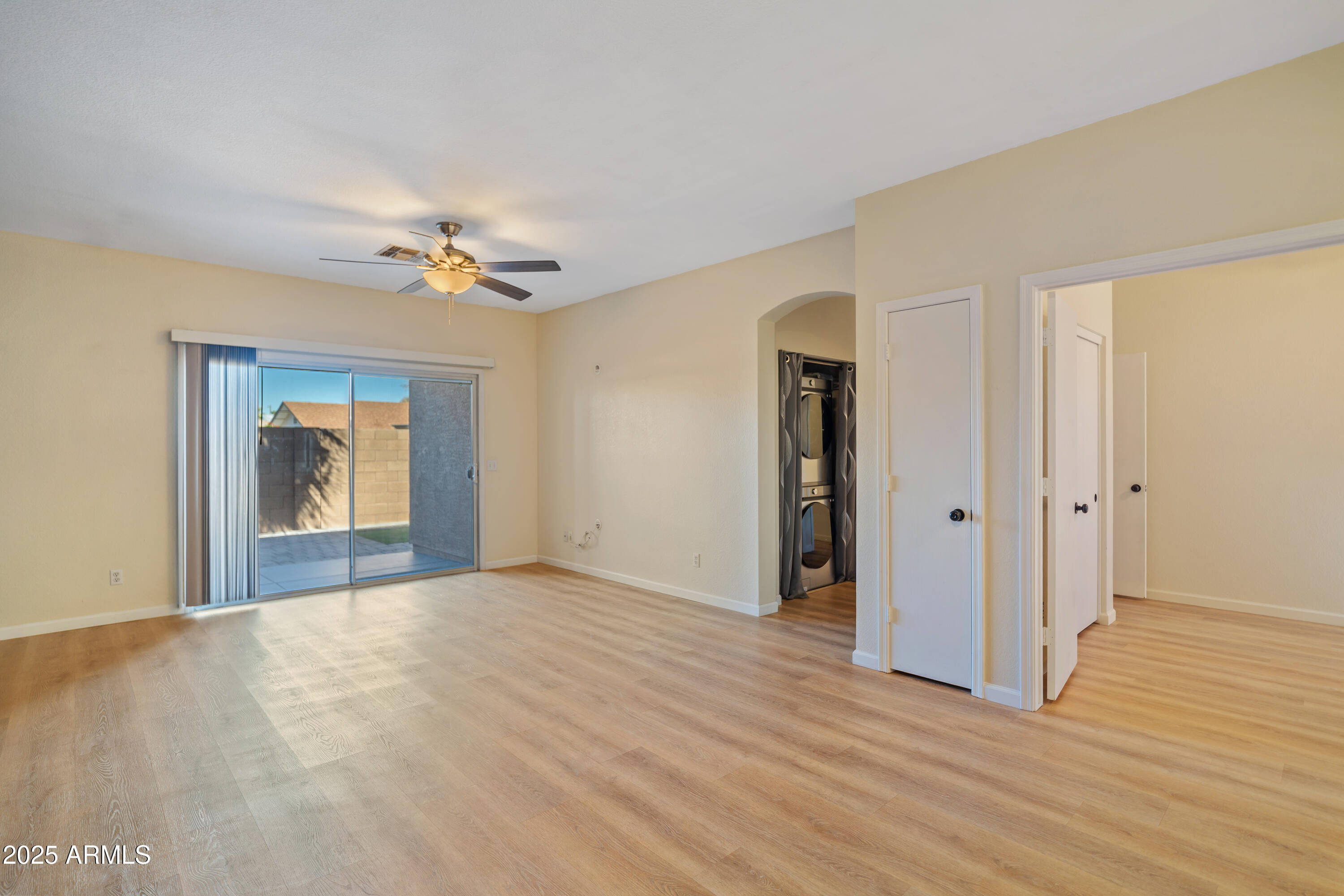 625 North Hamilton Street, Unit 41 Chandler, AZ 85225 - Photo 8 of 25 a view of an empty room with window and wooden floor