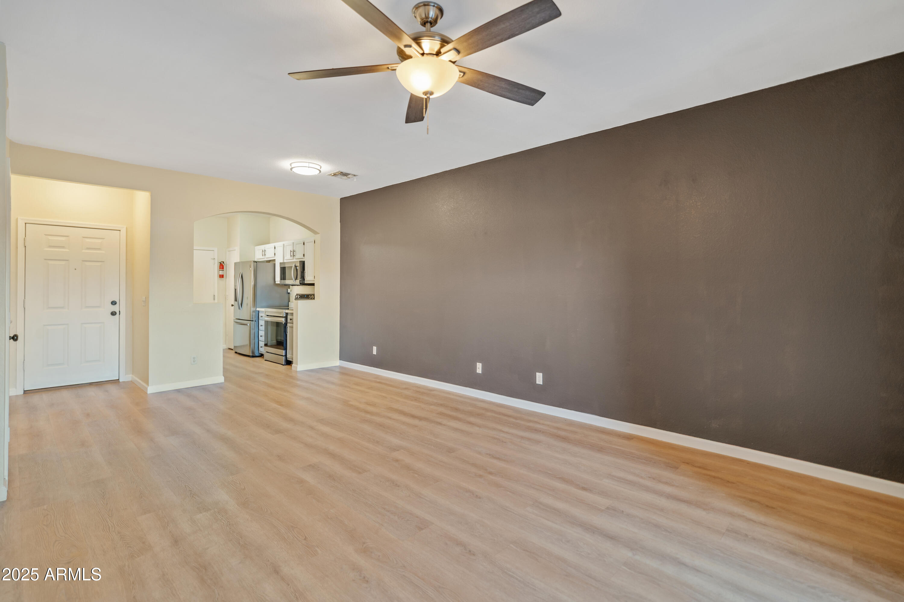 625 North Hamilton Street, Unit 41 Chandler, AZ 85225 - Photo 10 of 25 an empty room with closet and a ceiling fan