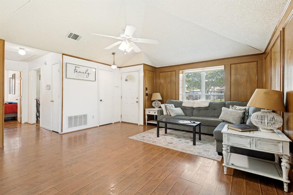 7410 Jessica Way Rowlett, TX 75088 - Photo 6 of 25 a living room with furniture and wooden floor