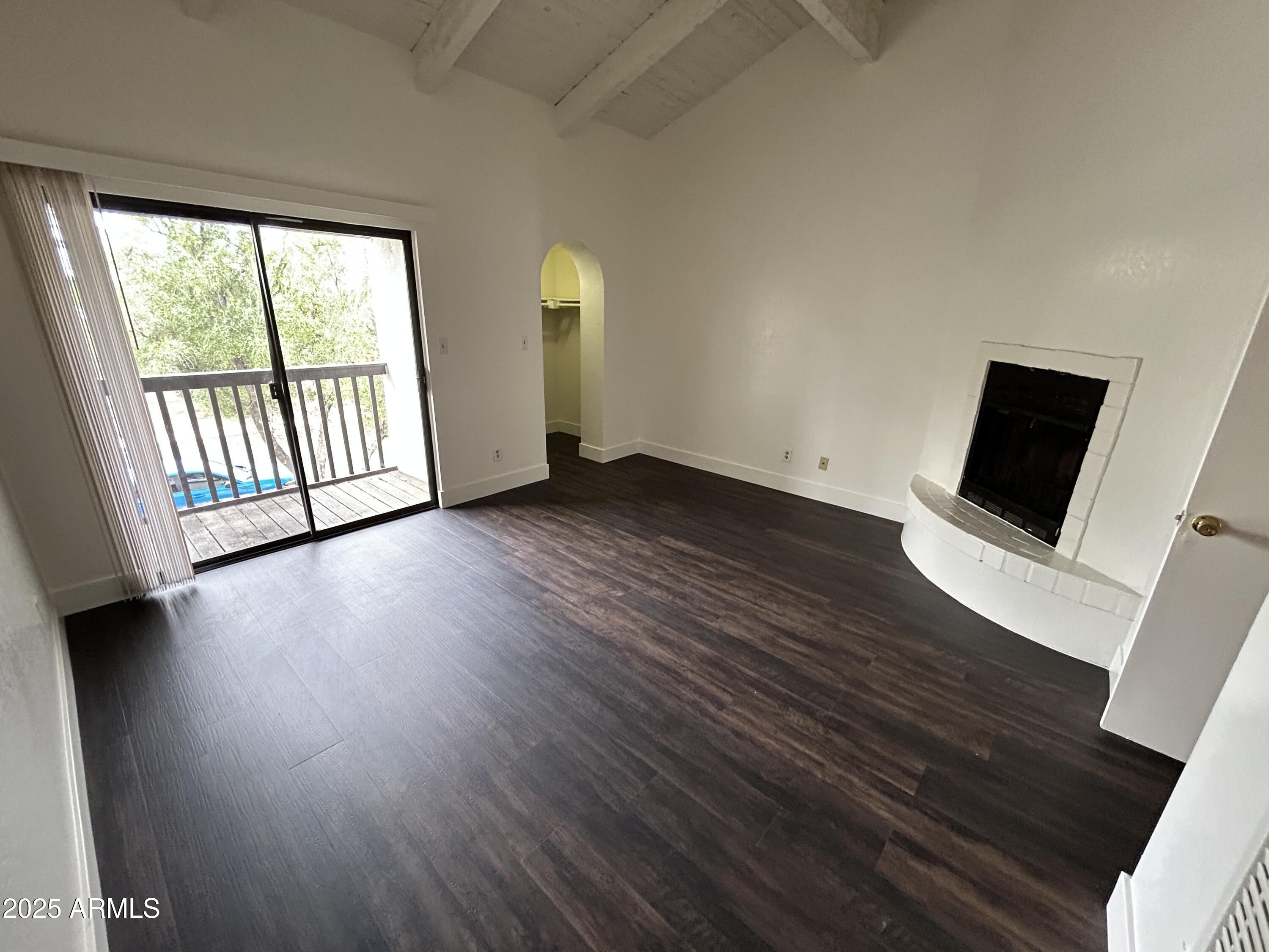 1702 East Ocotillo Road, Unit 2 Phoenix, AZ 85016 - Photo 12 of 18 a view of a room with wooden floor and windows