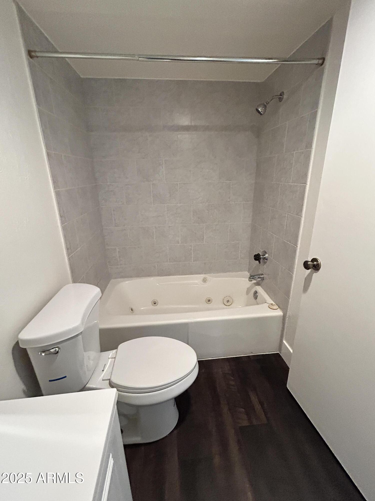 1702 East Ocotillo Road, Unit 2 Phoenix, AZ 85016 - Photo 14 of 18 a bathroom with a toilet and a bathtub