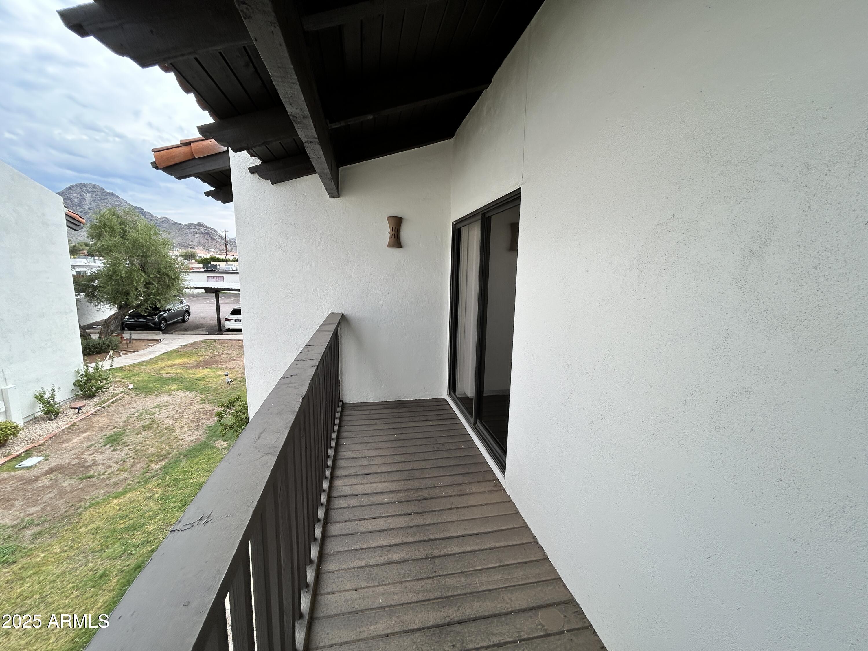 1702 East Ocotillo Road, Unit 2 Phoenix, AZ 85016 - Photo 17 of 18 a view of balcony with wooden floor and fence
