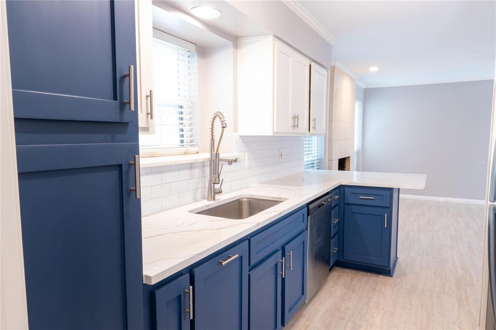 6509 Preston Road, Unit 1 University Park, TX 75205 - Photo 5 of 15 a kitchen with a sink cabinets and window