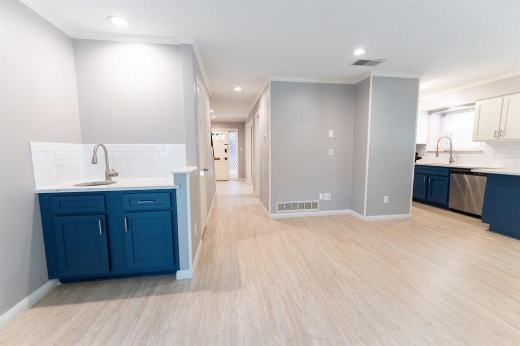 6509 Preston Road, Unit 1 University Park, TX 75205 - Photo 6 of 15 a large bathroom with a sink and a mirror