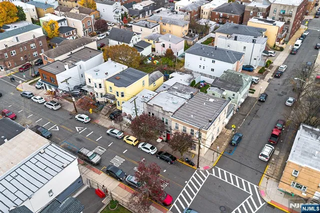 an aerial view of residential house with parking space