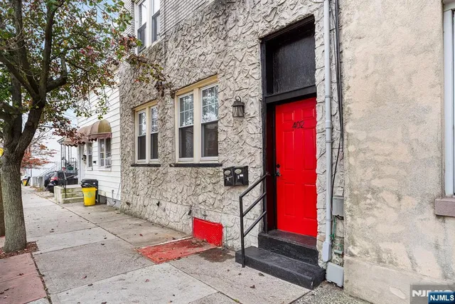 a view of building along with tall trees