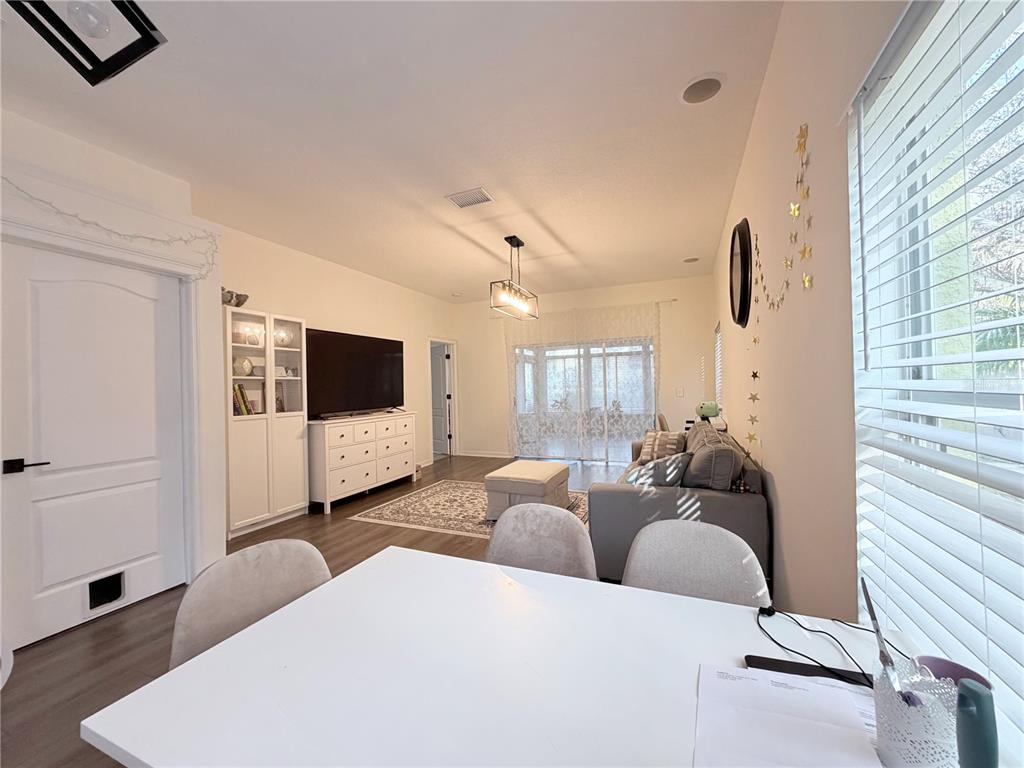 5634 Tanagerlake Road Lithia, FL 33547 - Photo 11 of 46 a living room with furniture and a flat screen tv