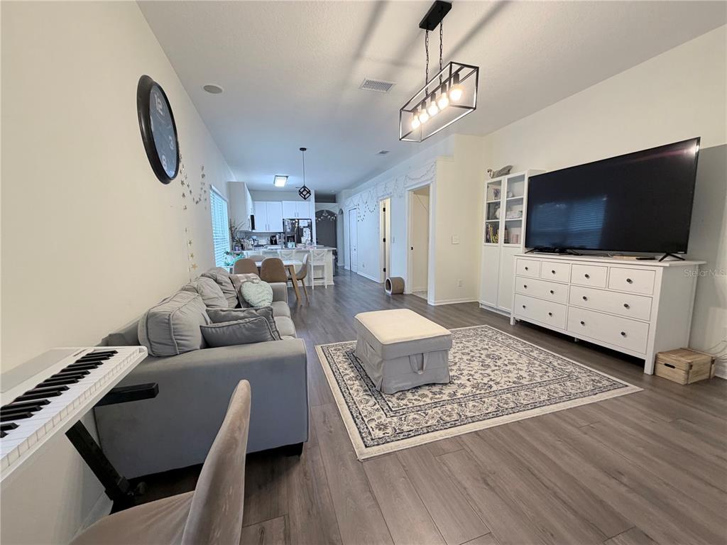 5634 Tanagerlake Road Lithia, FL 33547 - Photo 14 of 46 a living room with furniture and a flat screen tv