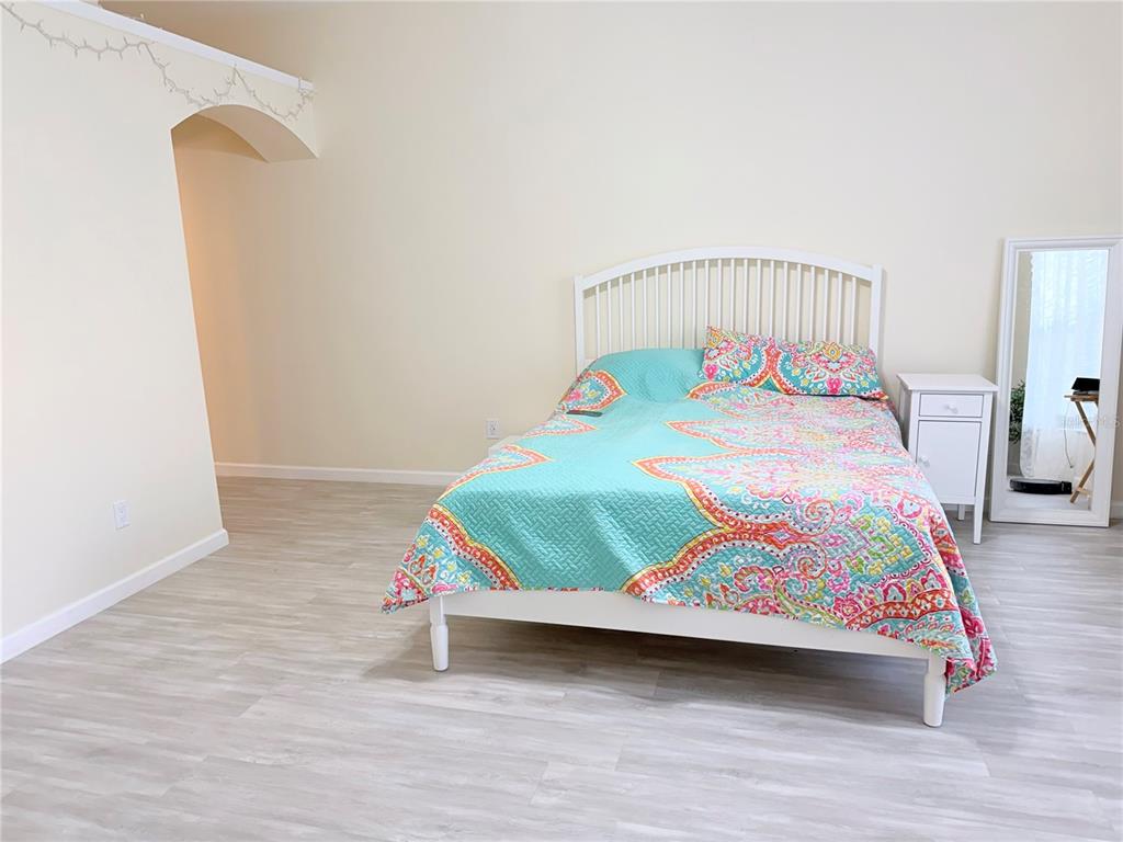 5634 Tanagerlake Road Lithia, FL 33547 - Photo 21 of 46 a bedroom with a bed and a table