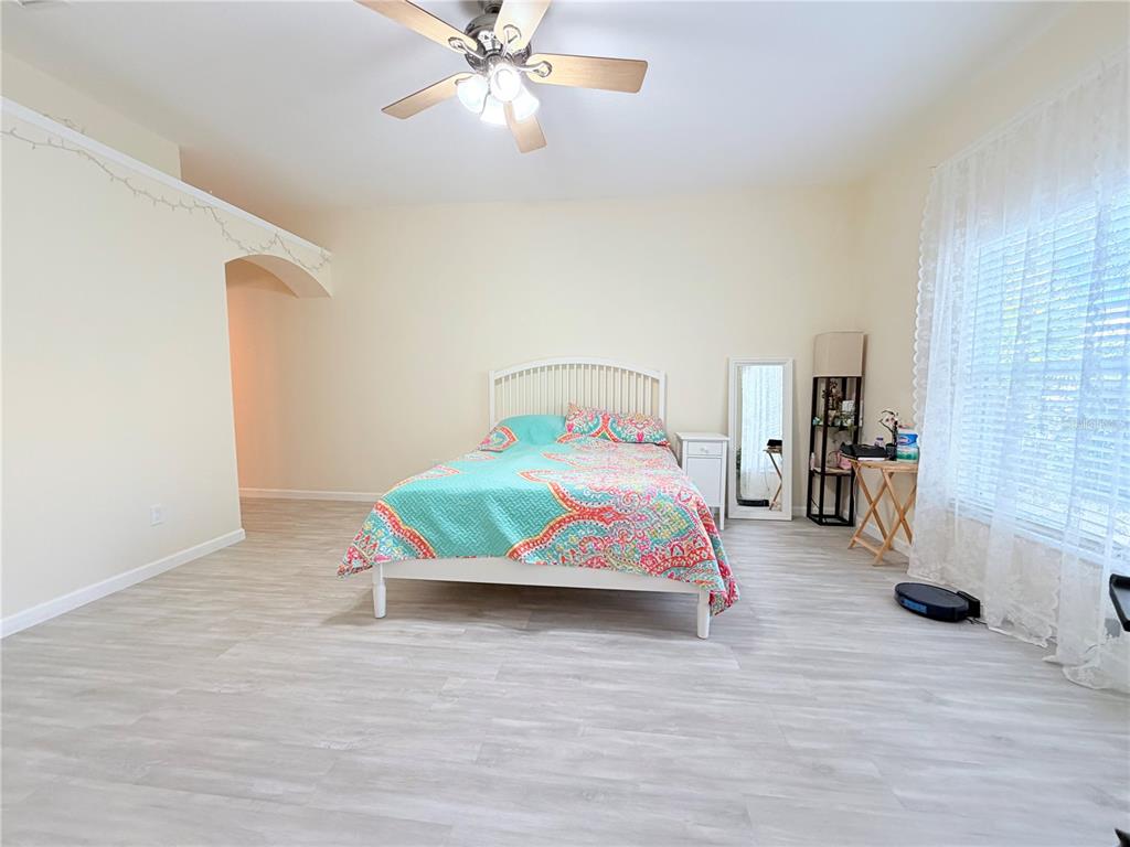 5634 Tanagerlake Road Lithia, FL 33547 - Photo 24 of 46 a bedroom with a bed and dresser