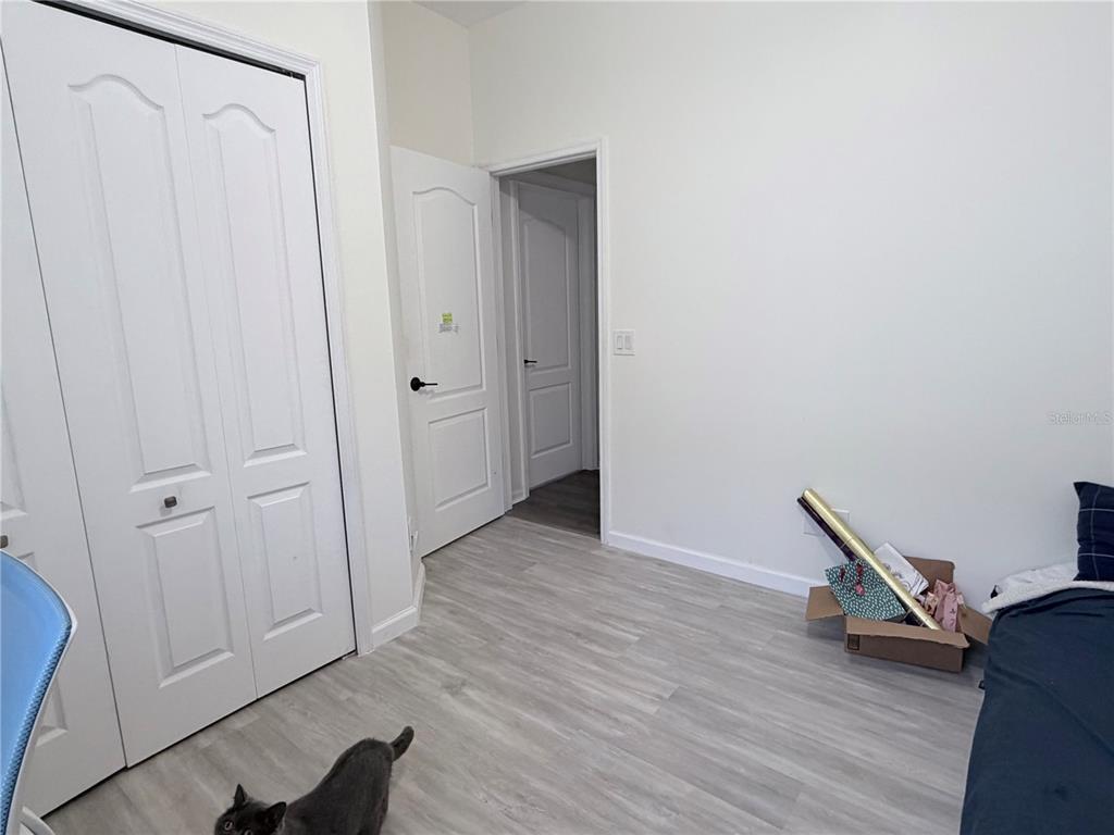 5634 Tanagerlake Road Lithia, FL 33547 - Photo 36 of 46 a view of an empty room with wooden floor and a window