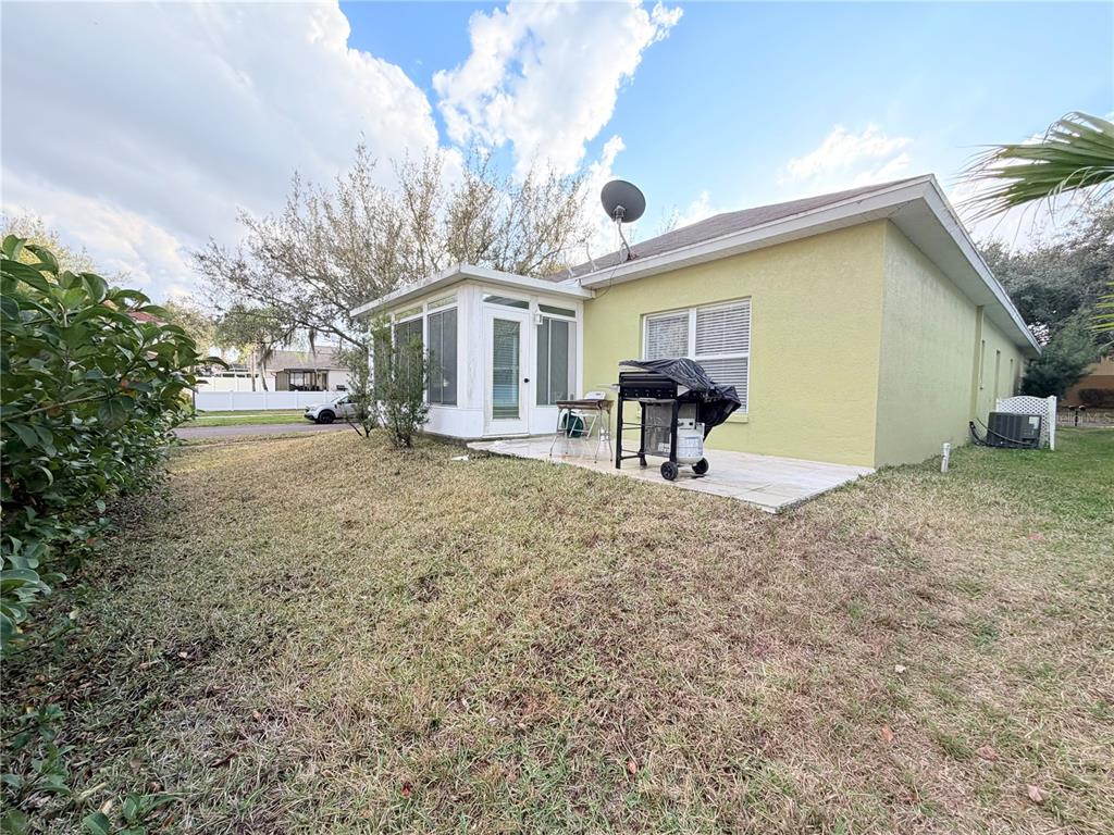 5634 Tanagerlake Road Lithia, FL 33547 - Photo 43 of 46 a view of a house with a yard and sitting area