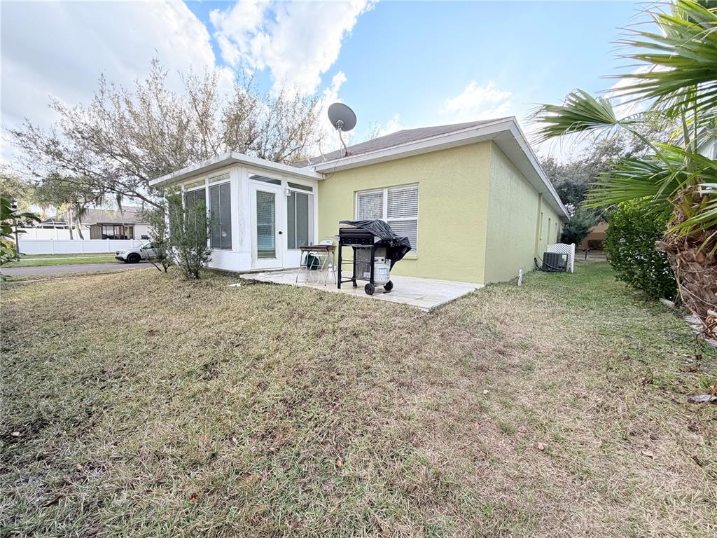 5634 Tanagerlake Road Lithia, FL 33547 - Photo 45 of 46 a view of a house with backyard and chairs
