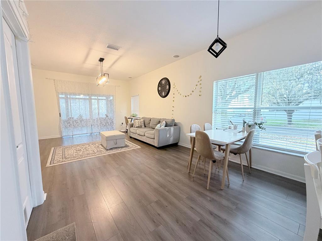 5634 Tanagerlake Road Lithia, FL 33547 - Photo 10 of 46 a living room with furniture and a wooden floor