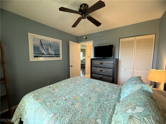a living room with furniture a table and a flat screen tv