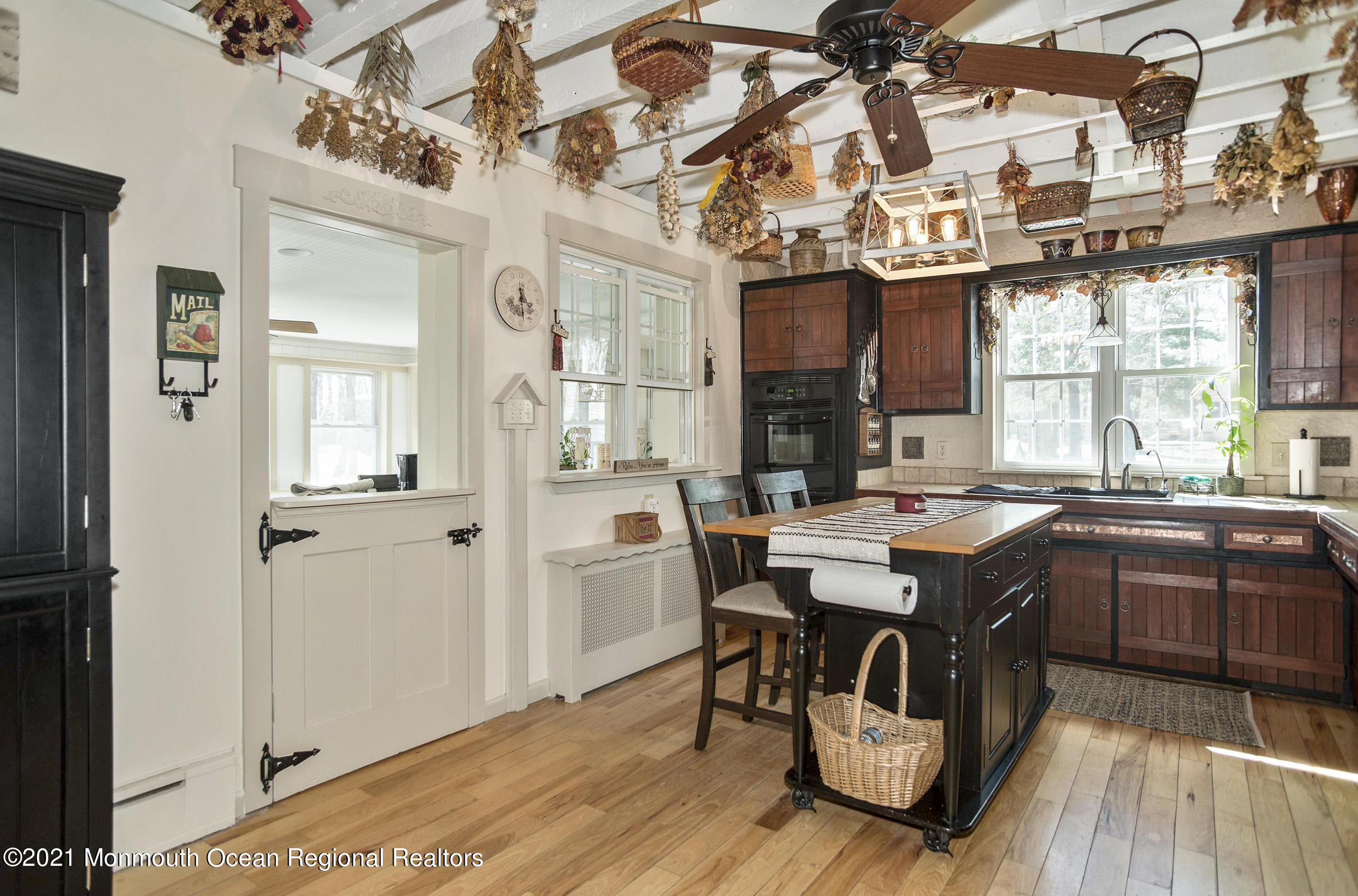 511 Cerrina Road Jackson, NJ 08527 - Photo 16 of 46 a view of a dining room with furniture window and wooden floor