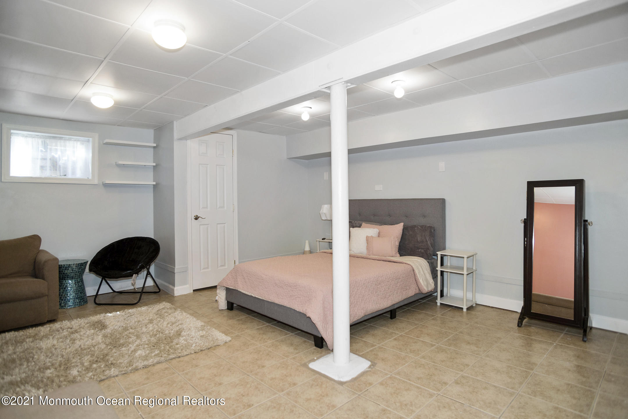 511 Cerrina Road Jackson, NJ 08527 - Photo 33 of 46 a bedroom with a bed and a chair