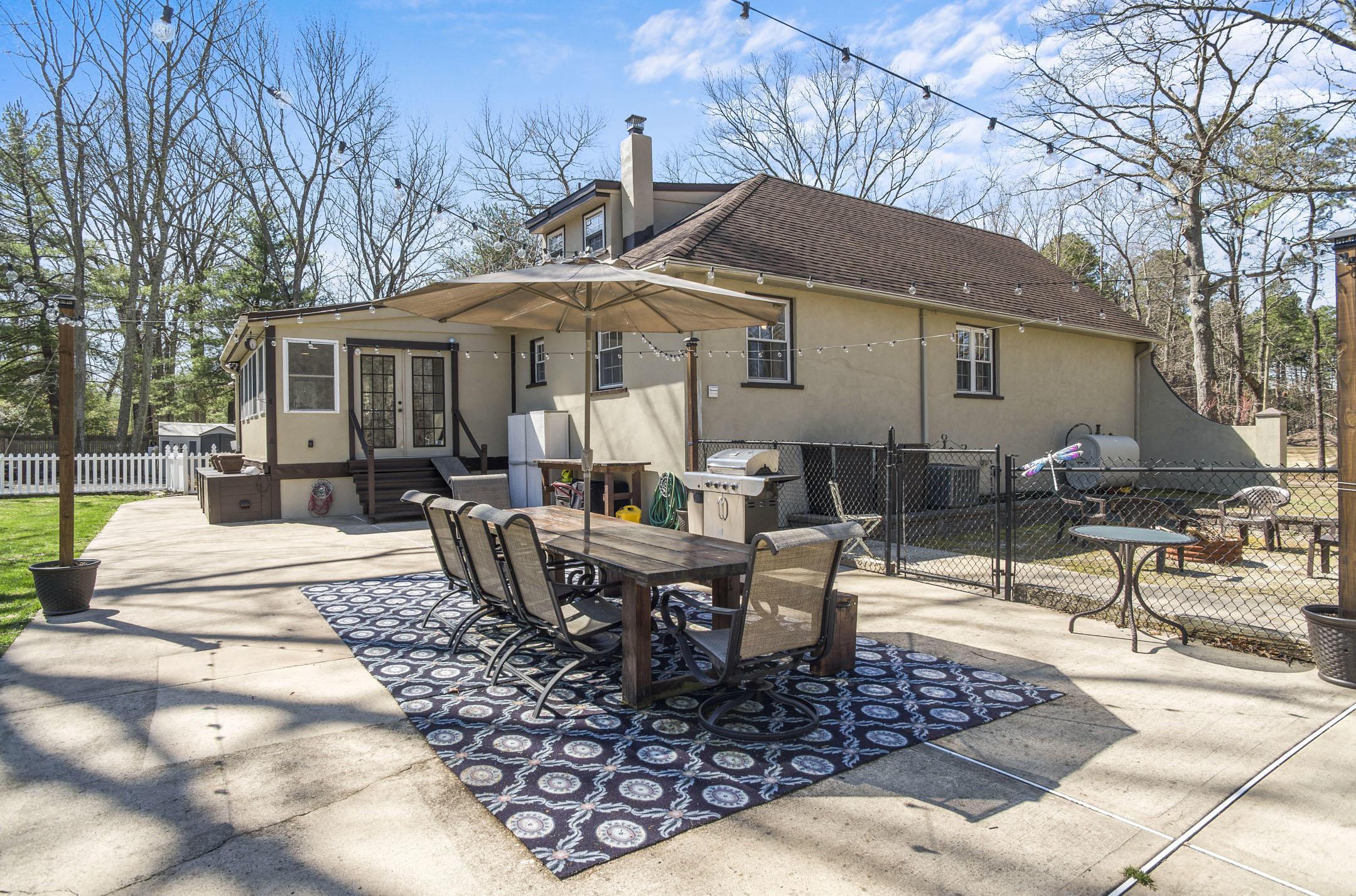 511 Cerrina Road Jackson, NJ 08527 - Photo 36 of 46 a view of a patio with couches table and chairs and potted plants