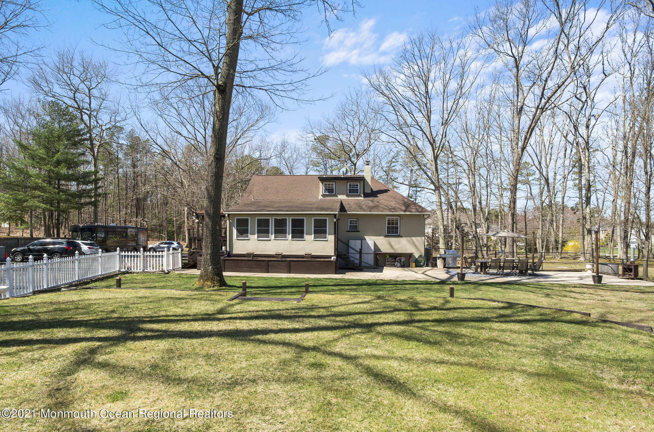 511 Cerrina Road Jackson, NJ 08527 - Photo 41 of 46 a view of a swimming pool with lawn chairs under an umbrella