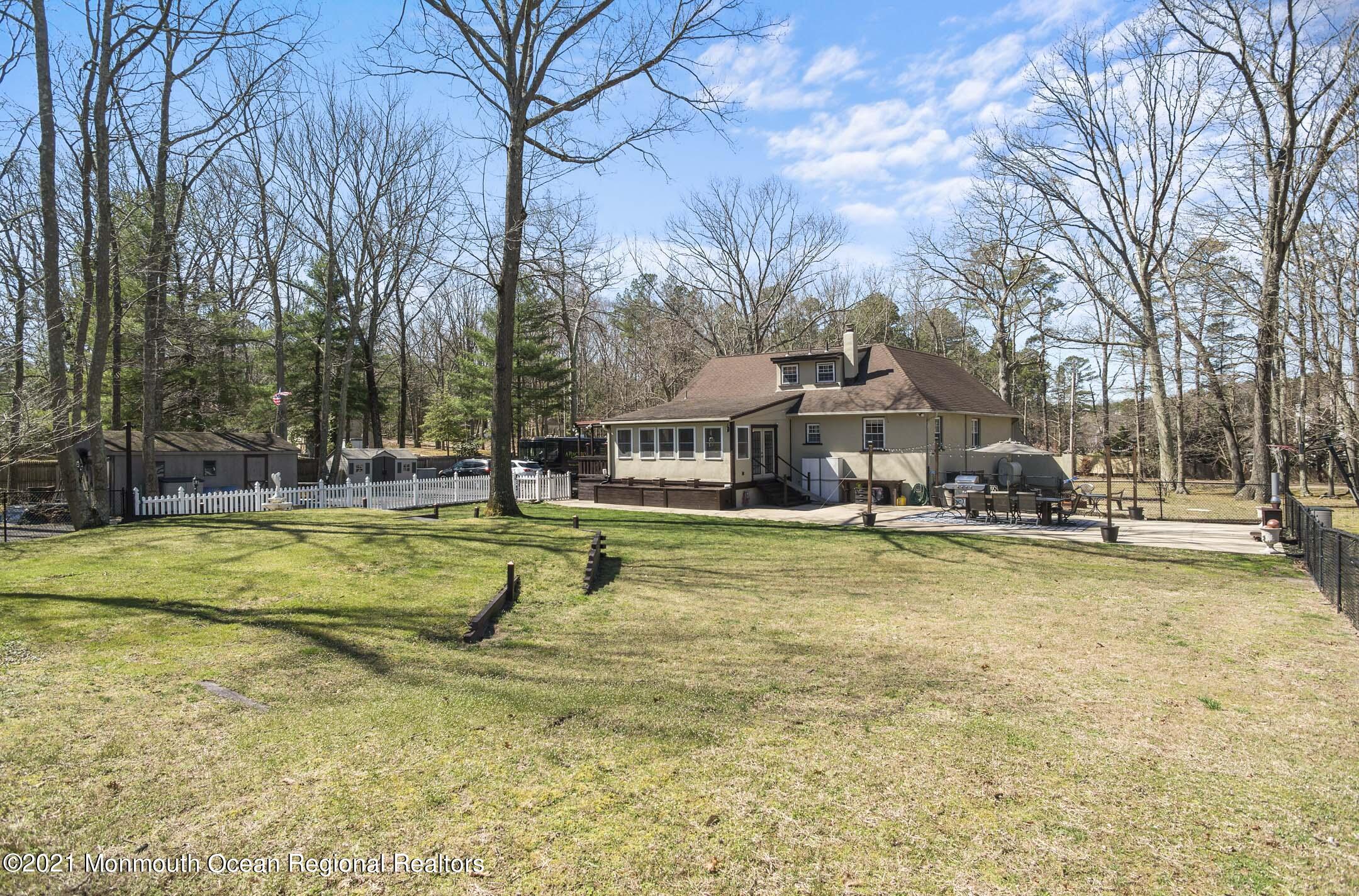 511 Cerrina Road Jackson, NJ 08527 - Photo 42 of 46 a swimming pool with outdoor seating and yard