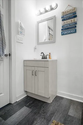 a view of cabinets with wooden floor