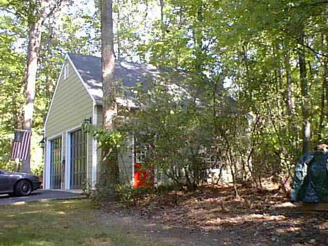2272 Whippoorwill Road Charlottesville, VA 22901 - Photo 3 of 3 a front view of a house with a yard