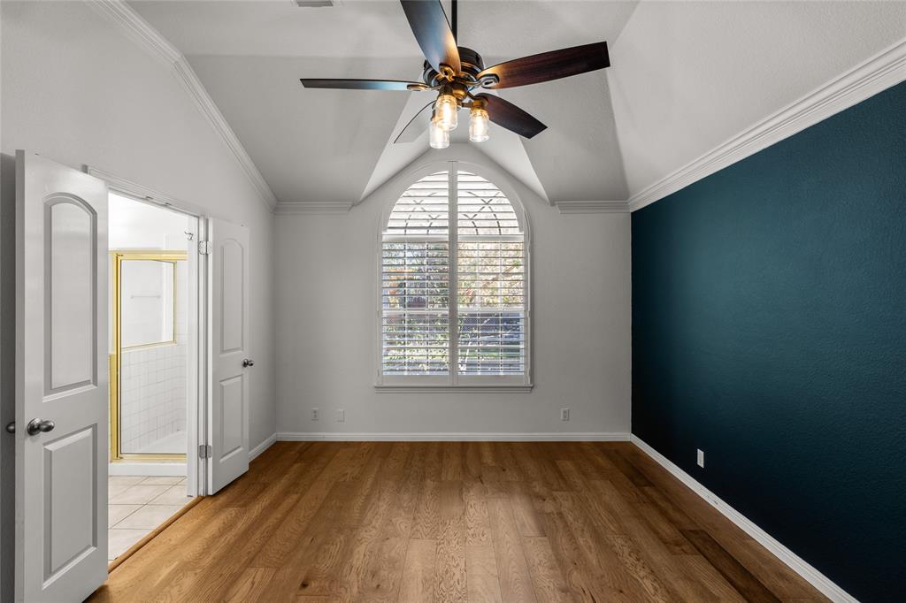 3901 Caney Creek Road Austin, TX 78732 - Photo 9 of 18 Primary bedroom features hardwood floors and vaulted ceiling.
