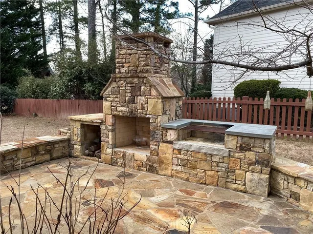 a view of roof deck with patio