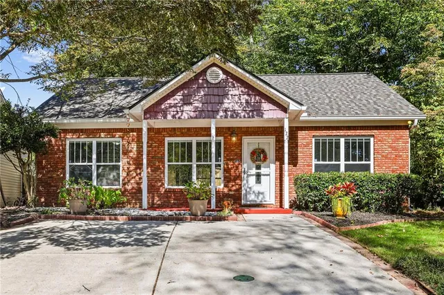 a front view of a house with garden
