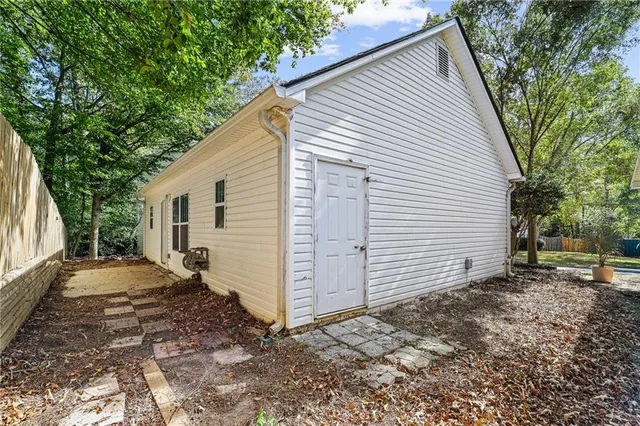 a view of a backyard with a large tree