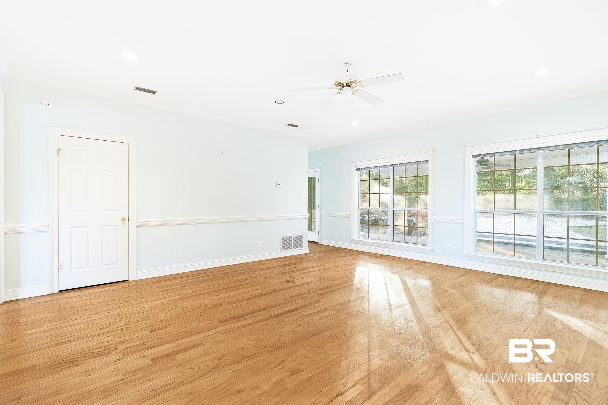 2100 Stonebrook Drive West Mobile, AL 36695 - Photo 11 of 60 Unfurnished room with ceiling fan, light wood-type flooring, and ornamental molding