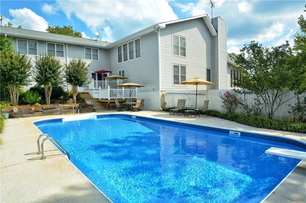 301 Spruill Bridge Road Temple, GA 30179 - Photo 17 of 73 a swimming pool view with a outdoor seating