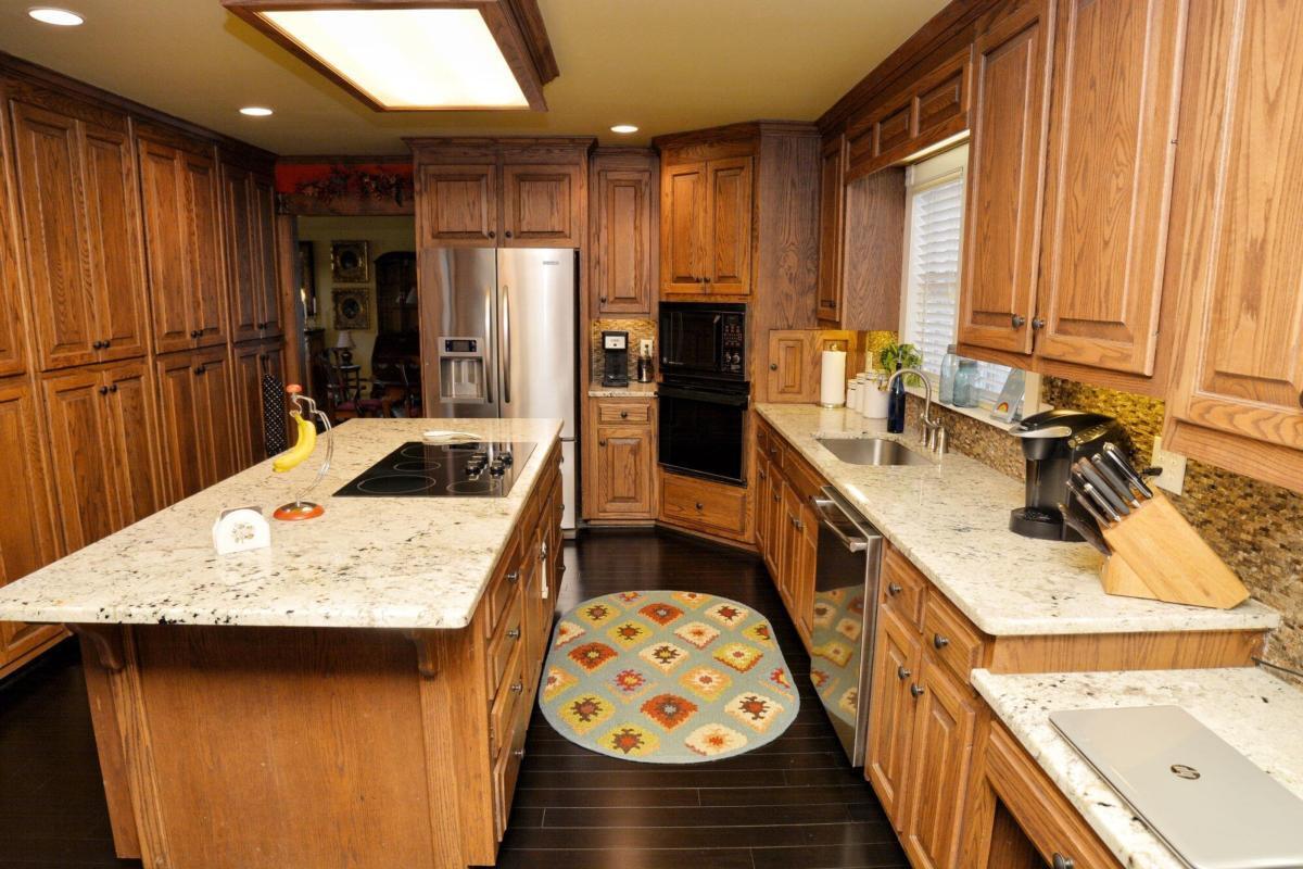 301 Spruill Bridge Road Temple, GA 30179 - Photo 18 of 73 a kitchen with a sink stove and refrigerator