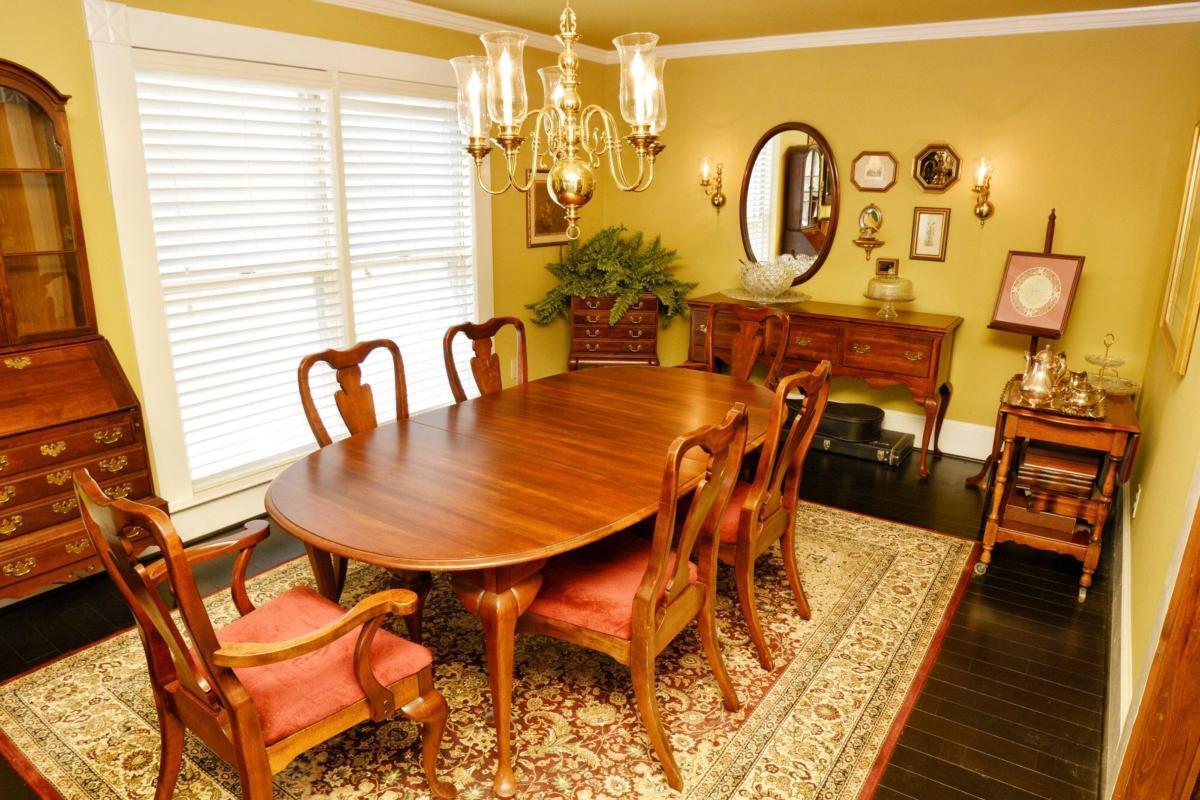 301 Spruill Bridge Road Temple, GA 30179 - Photo 36 of 73 a view of a dining room with furniture and wooden floor