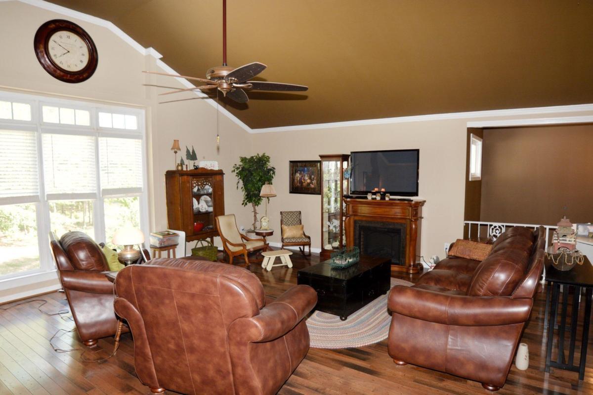 301 Spruill Bridge Road Temple, GA 30179 - Photo 43 of 73 a living room with furniture a fireplace and a large window