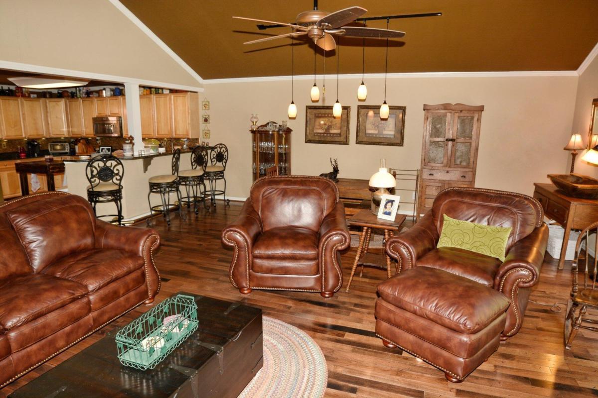 301 Spruill Bridge Road Temple, GA 30179 - Photo 45 of 73 a living room with furniture and wooden floor