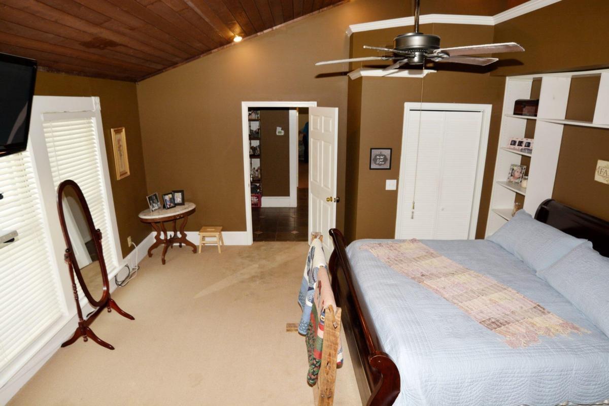 301 Spruill Bridge Road Temple, GA 30179 - Photo 57 of 73 a bedroom with a bed furniture and a window