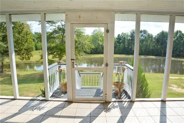 a view of a balcony with wooden floor