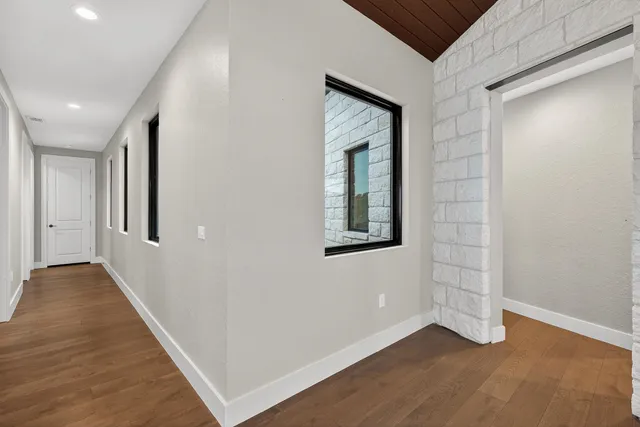 a view of an entryway with wooden floor