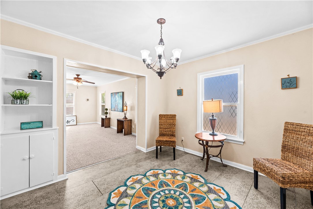 714 Indiana Avenue Corpus Christi, TX 78404 - Photo 11 of 38 a living room with furniture and a chandelier