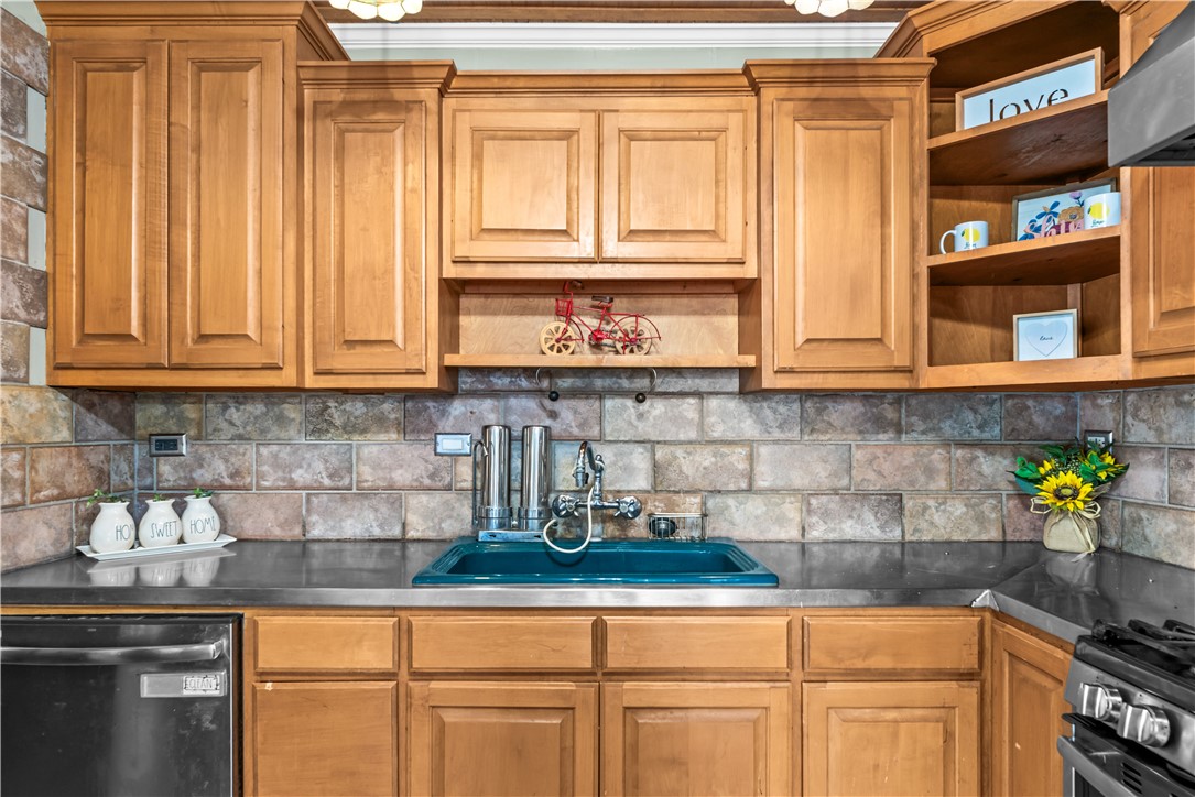 714 Indiana Avenue Corpus Christi, TX 78404 - Photo 15 of 38 a kitchen with stainless steel appliances granite countertop a sink and cabinets