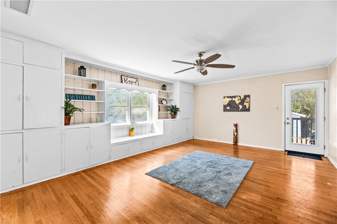 714 Indiana Avenue Corpus Christi, TX 78404 - Photo 17 of 38 a view of an empty room with window and wooden floor