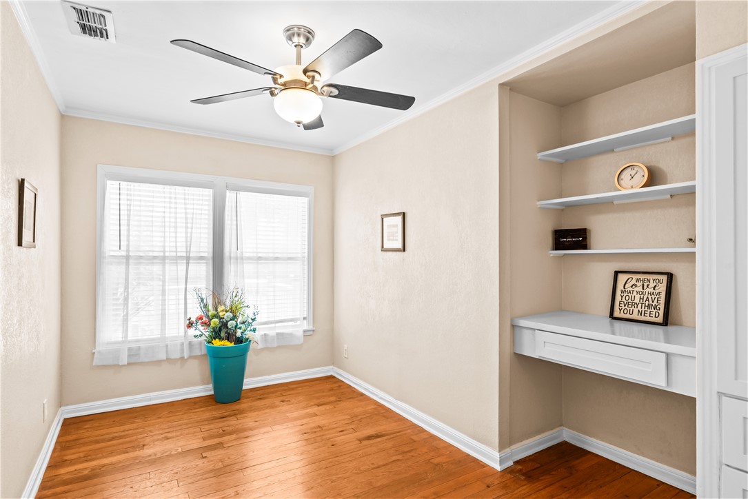 714 Indiana Avenue Corpus Christi, TX 78404 - Photo 21 of 38 a view of an empty room with a window and wooden floor