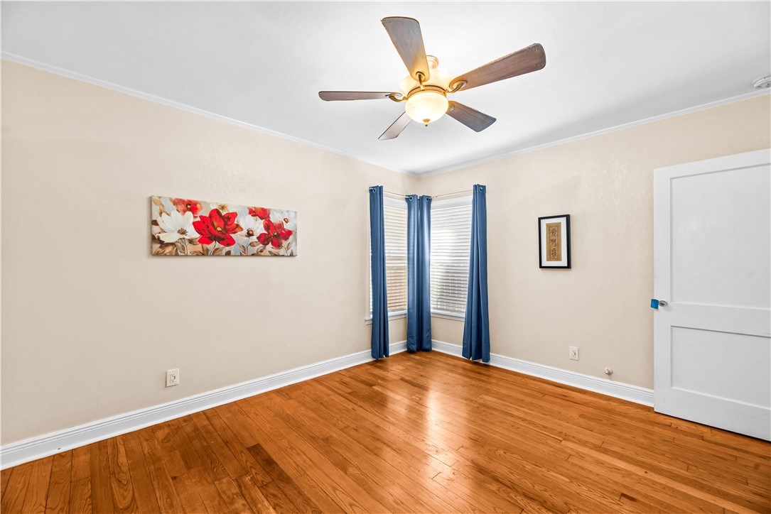 714 Indiana Avenue Corpus Christi, TX 78404 - Photo 26 of 38 a view of a big room with wooden floor and chandelier fan